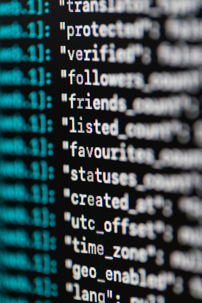 heros-img Extreme close-up of computer code displaying various programming terms and elements.